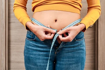 What customs must you stop to reduce fat around your belly?