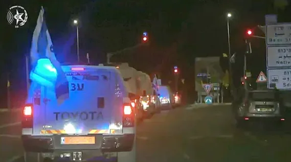 A convoy carrying four coffins of dead hostages to Israel