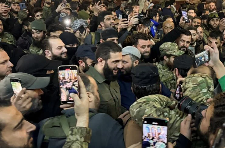 Who is Abu Mohammed al-Golaan, the leader of the uprising that overthrew al-Assadin in Syria?