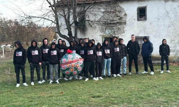 The burial ceremony of two young men killed in Kline begins, friends wear shirts with their photos