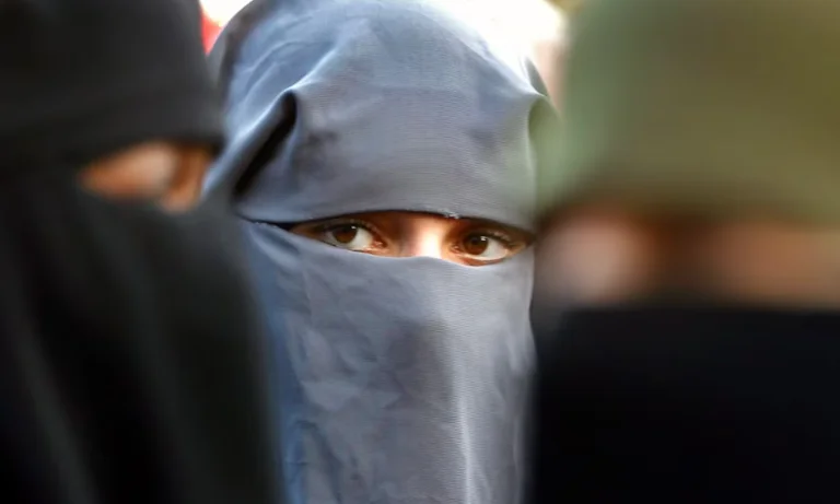 By January, Switzerland bans face coverage in public spaces