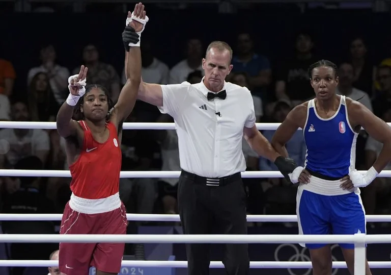 Boxer Cindy Damba é first refugee team athlete to win medals at the Paris Olympics
