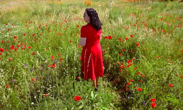 President gives Drenica a buzz from a field of redflower