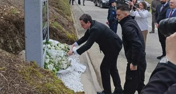 Kurt goes to where police Officer Enver Zymer was killed, clears up plates for him