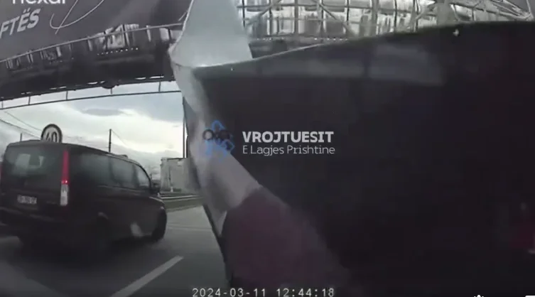 Scary: Strong winds bring down an advertising pan in magistrates, the driver on the <x0 street is at risk