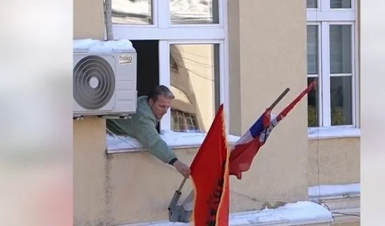 The moment Albania Arifi places national flag in Presevo municipality object