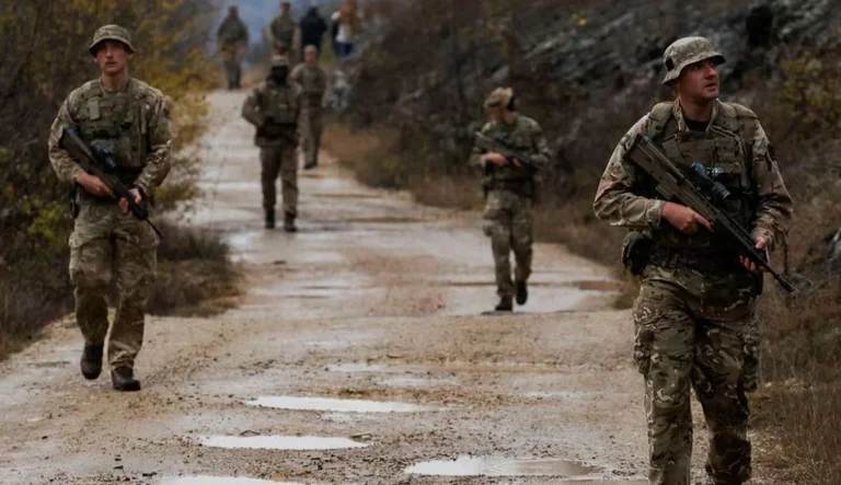 REUTERS: Brits are guarding Kosovo's 18-hour changing border, making sure they're breaking into weapons and armed groups