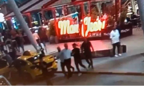 Il momento di arresto dello sposo di Berisha: con le manette nelle mani, accompagnato da tre efficaci
