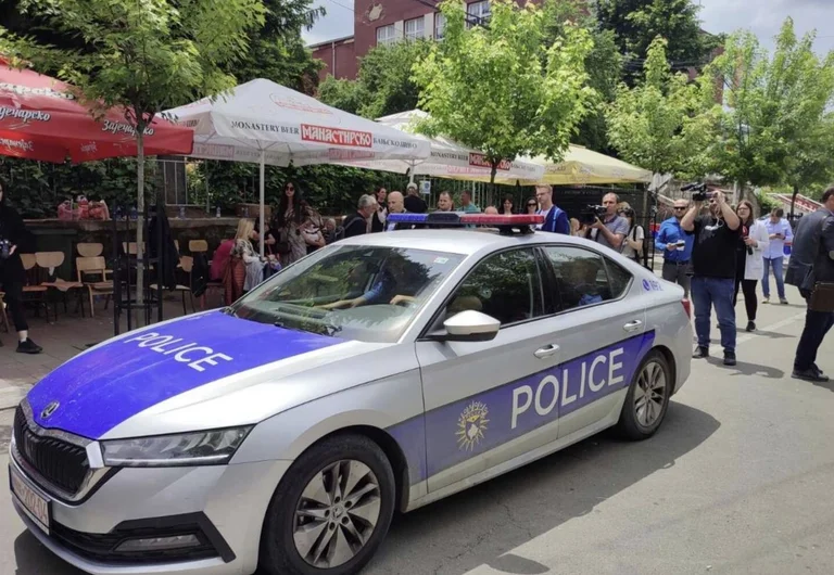 Protesters block the Zvecan Police vehicle, there are three policemen inside