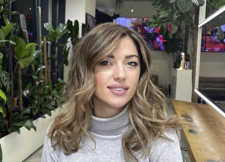 Minister Albulen Haxhiu's hair is being used for advertising by the Friser salons
