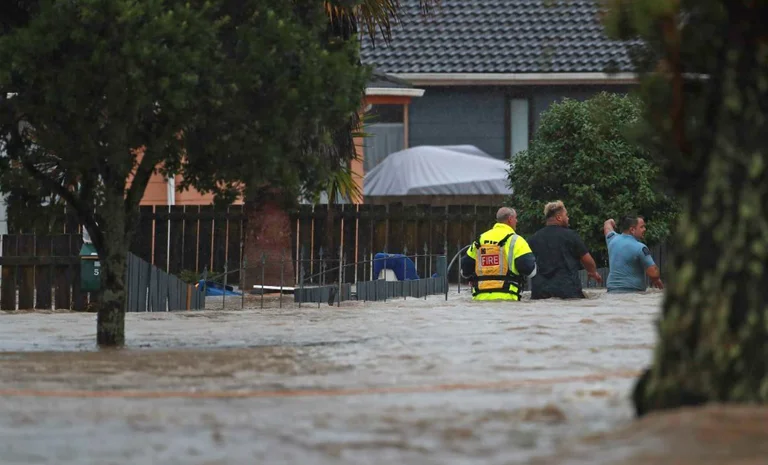 Heavy rains kill three people in New Zealand, at least one missing.