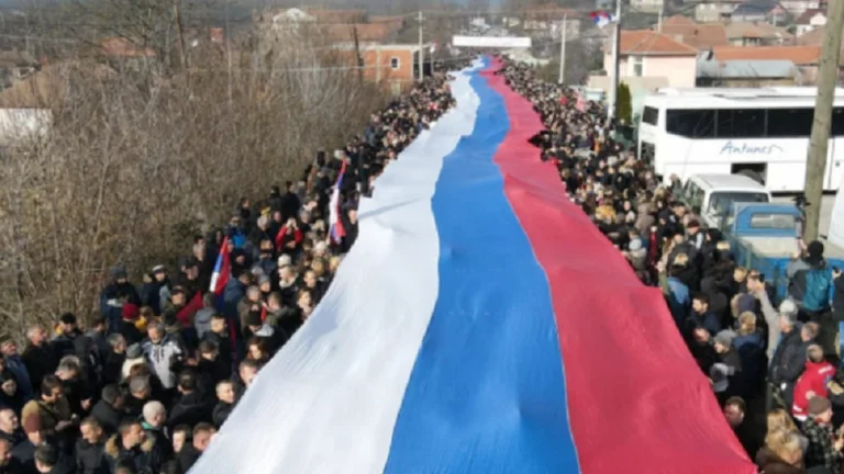 A 250m-long flag has been unveiled at Serb protest in Kosovo