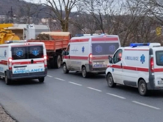 Three ambulances are seen at the location where barricades are placed in the north