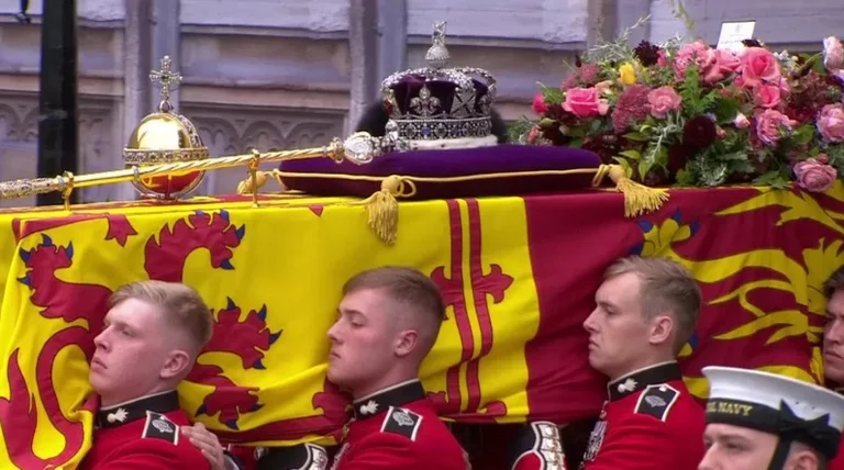 King Charles III follows his mother's coffin