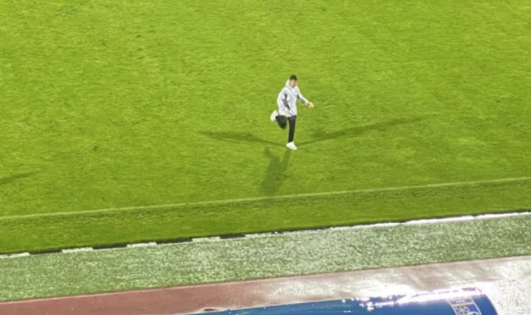 A fan joins the field during the Pristina-Balkan match