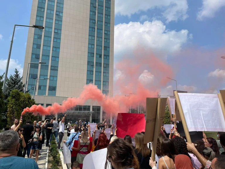 Protesters ring the door to Minister Albulen Hadziu