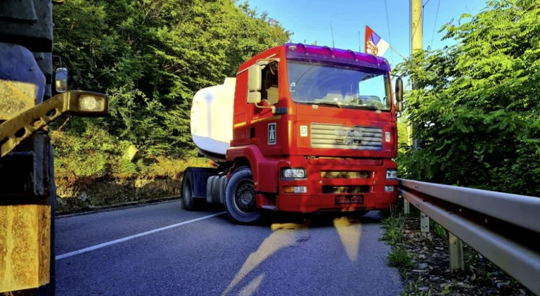 Whose trucks were used for barricades in the north?