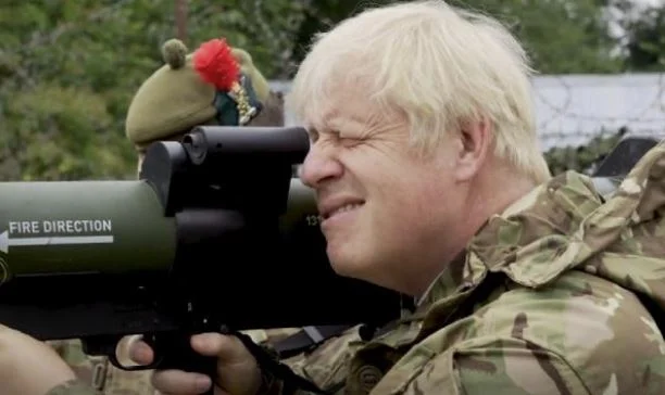 Johnson wears his uniform, joins Ukrainian troops in training