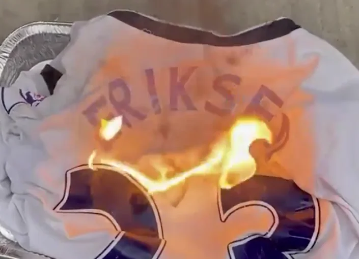 Embarrassed: Tottenham's tilt burns Eriksen's fan when he finds out that Danish is being transferred to Man United