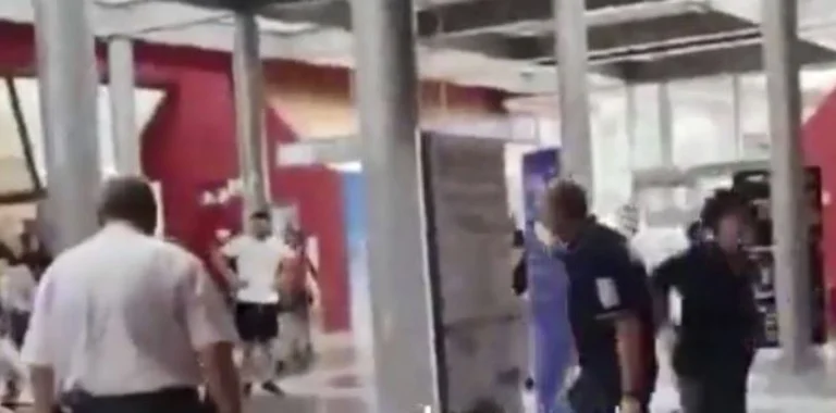 View: Placed between Albanians at Italy airport