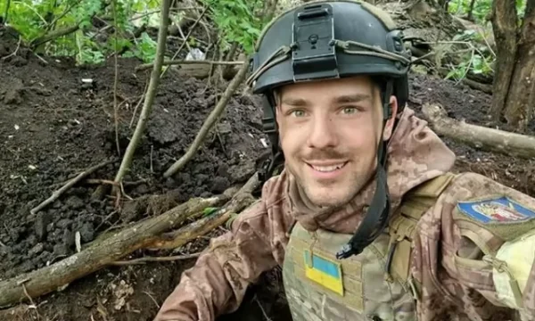 Ukrainians gather in Kiev to bid farewell to 24-year-old activist who was killed at the front