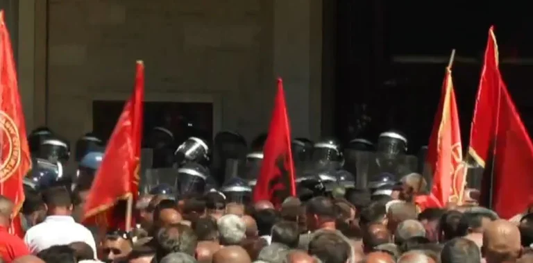 Police place their masks against tear gas