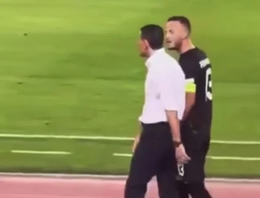 The real captain, undaunted, pressured the Greek coach to stop his fans.