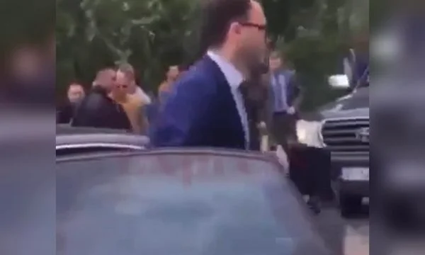 If he doesn't mind, Blerim Vela expects security to open the car door, step away.