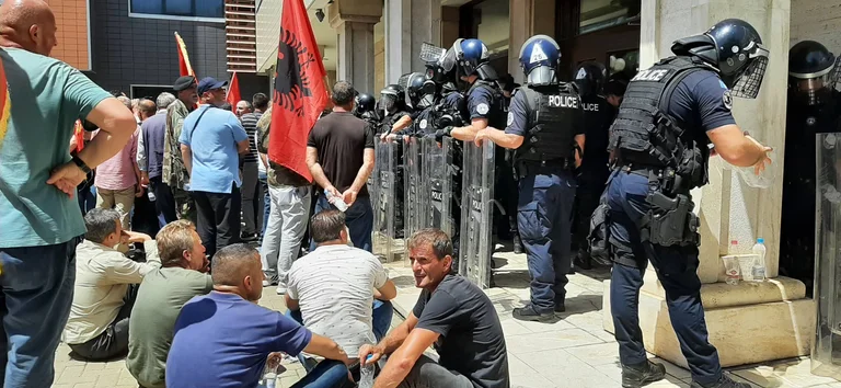 veterans protest, police: We got hurt by two officials, one hit with a hard tool on our head.