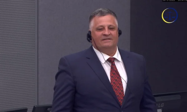 Smiled Nasim Haradinaj with red-and-black flag tie appeared today at the session