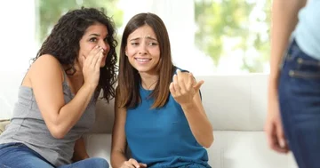 Eight signs they're talking about you in the back.