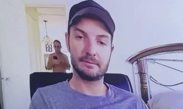 The man accidentally appears in the room while his partner was holding meetings in Zoom