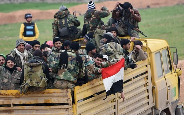 Syria's paramilitary fighters say they are willing to fight for Russia