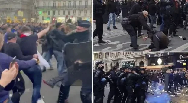 La polizia francese di “formed” battendo i fan di Chelsea prima del gioco Lee