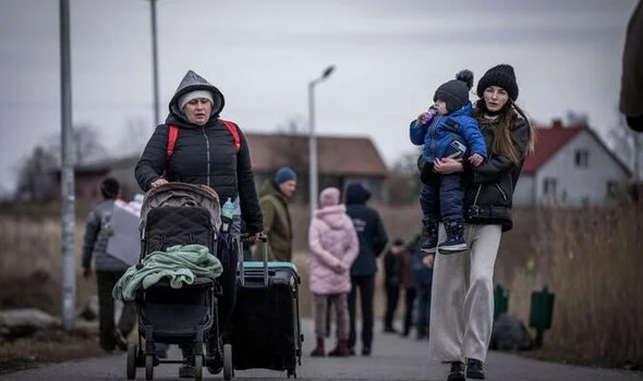 War fever: Ukrainian women and children head for the border