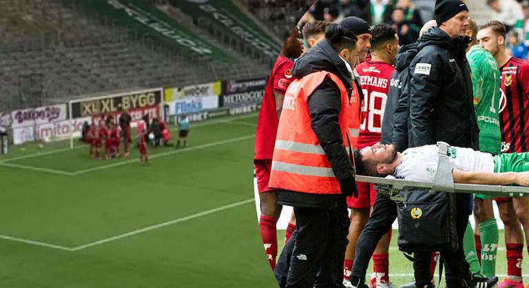 When Astrit Selmani is carried by stretcher after losing consciousness in the field