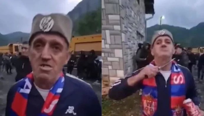 Serbischer Protester vor der Kamera droht verrückt mit kalten Waffen