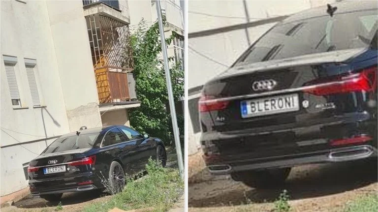 Bléron: Voiture de pension étrangère garée dans des espaces verts à Pristina