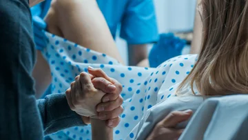 Grasping hands with your partner during the birth process is miraculous
