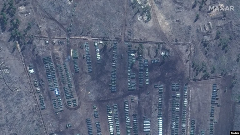 Russia orders troop withdrawal, but holds heavy weapons near Ukraine