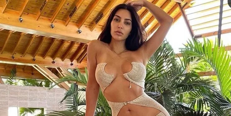 Kim Kardashian tells a lot about an open dress.