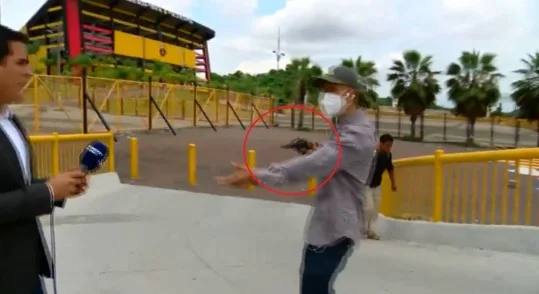 Sports journalist and cameraman experience horror: The guy with the gun stole his phone.