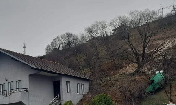 Scary: The house is covered up to half by soil after heavy rainfall