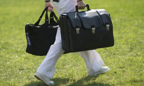 How is the delivery of the nuclear suitcase from Trump to Beden?