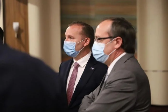 Zemaj Hoti with opposing statements, one says vaccines come in February, the other in March or April