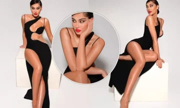 Adrola Dushi est livré avec pose chaude dans une robe noire