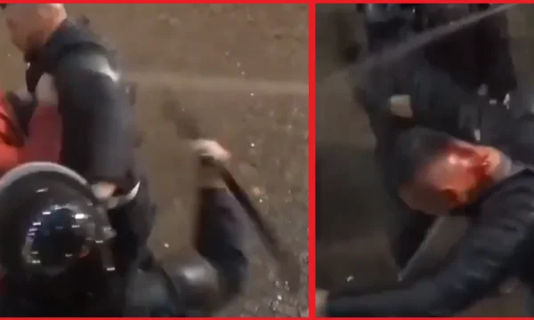 A view when police in Albania rip the head off rubber protesters