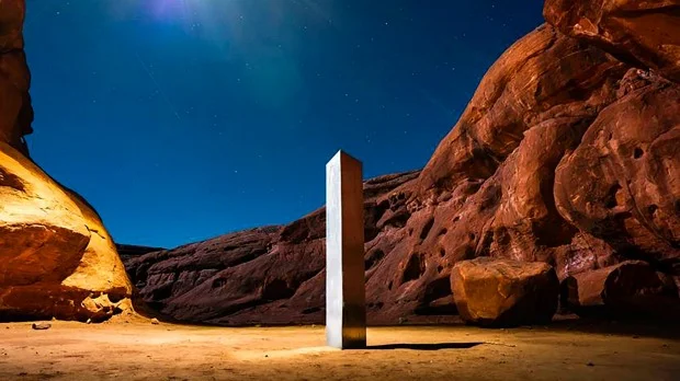 A group of artists assume responsibility for monolilytes emerging and disappearing around the world