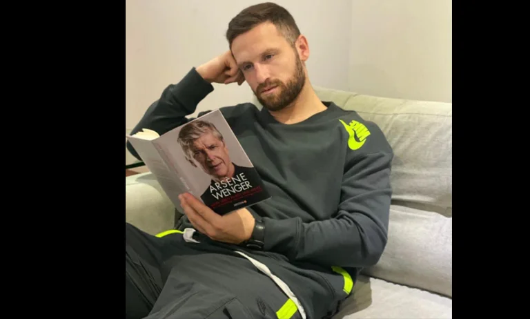 Mustaf is photographed reading Professor Wenger's book: Fans Violently Attacked