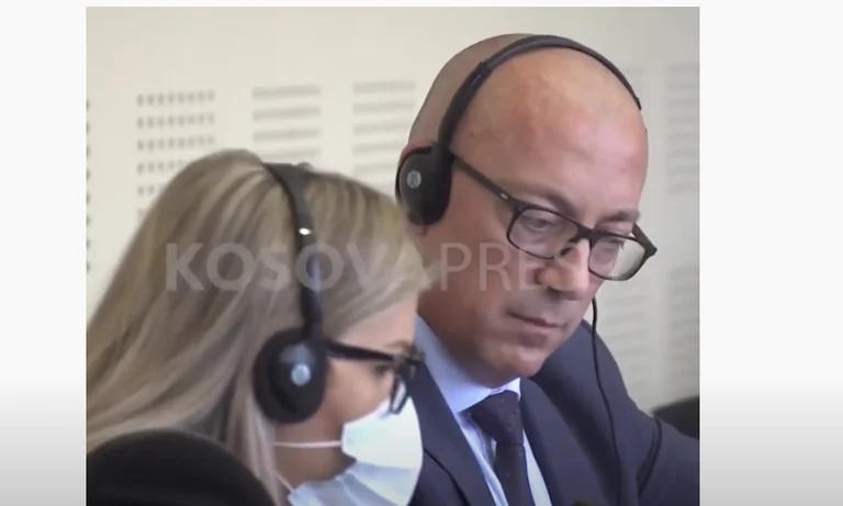 MP Mergim Lushtaku forces Goran Rakiq to stop talking while he calls out "Jeezani"